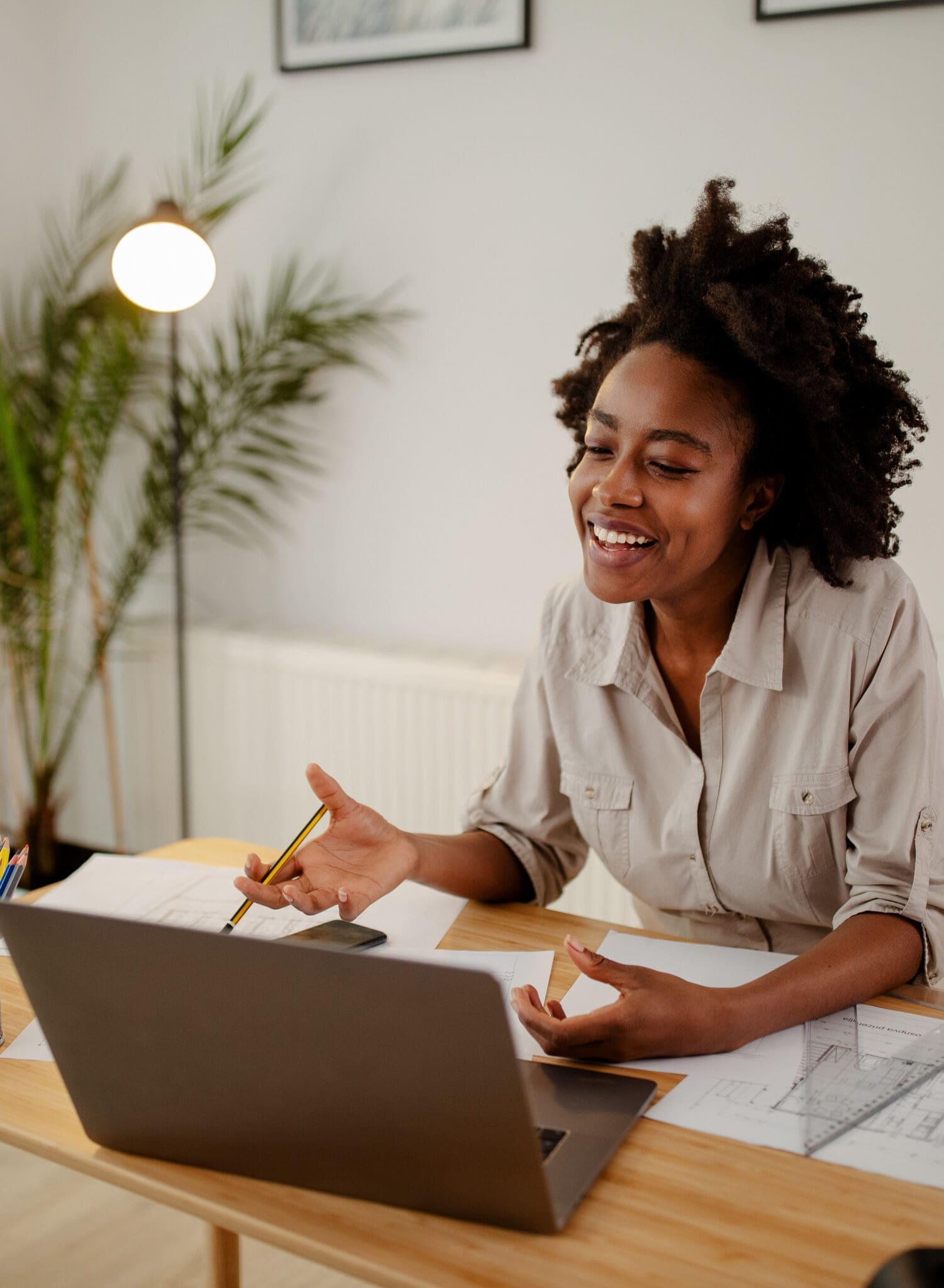 Image of happy black woman, smiling while speaking or chatting o